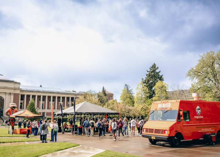 students and staff gather in MU Quad with Beaver Cheese food truck