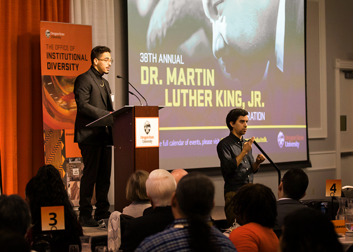 Jordan stands at podium and addresses guests at the 2020 38th annual Dr. MLK, Jr. Celebration