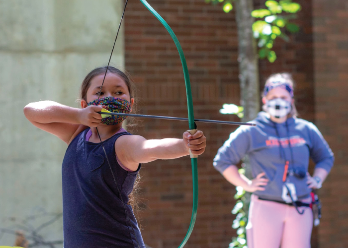 Photo of KidSpirit participant using a recurve bow