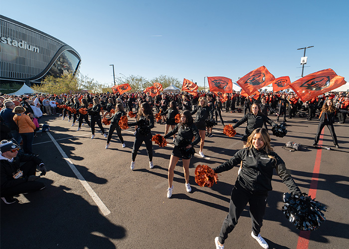 Cheerleaders at Las Vegas Bowl wearing black and orange